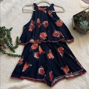 blue Floral printed romper with a tie neck